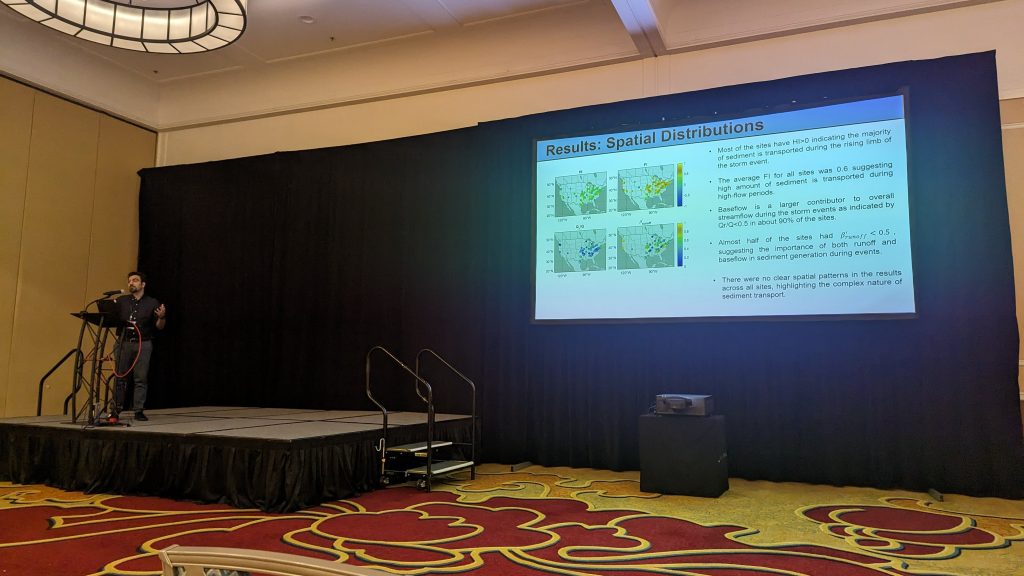 Amirreza presents a talk on "Assessing Continental Gradients In The Significance of Runoff and Baseflow To Turbidity Generation In Streams" at the SEDHYD session on Using Tracers to Characterize Sediment Sources and Dynamics.